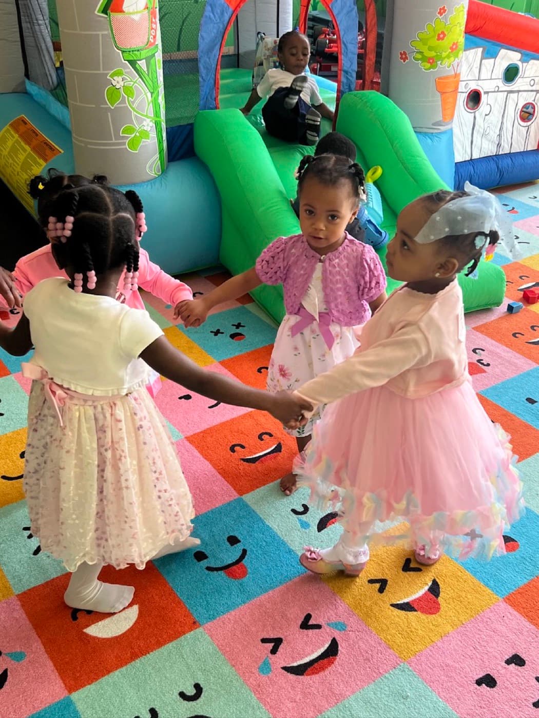 Young children playing together in the colorful iKIDZ room at Impact City Church