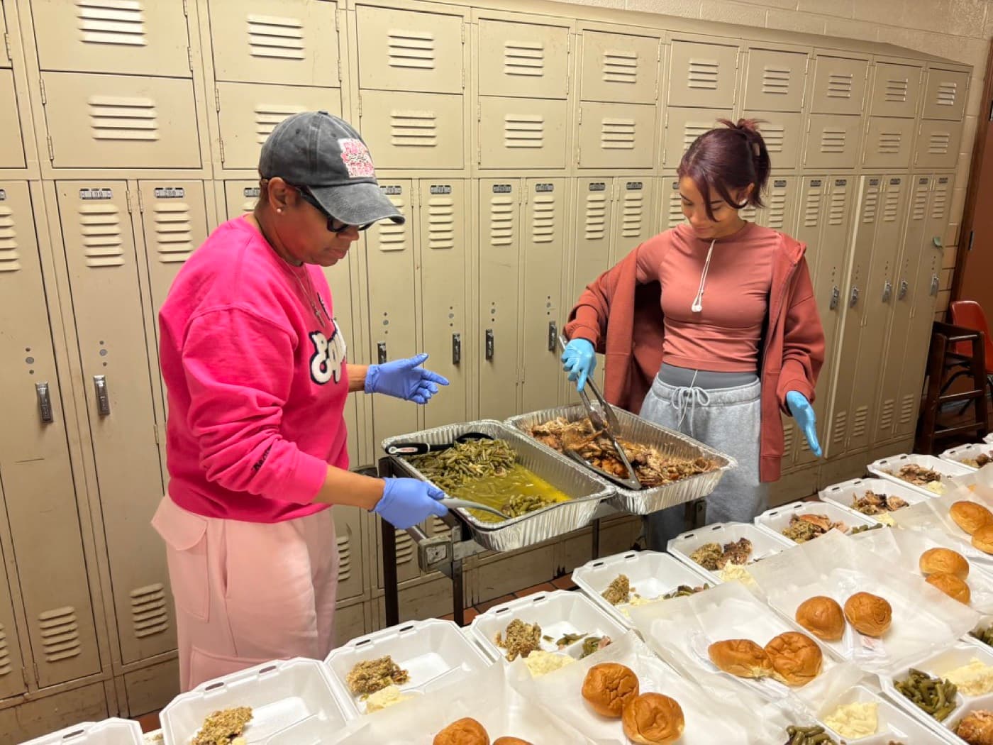 Impact City Church volunteers plating Thanksgiving meals for the community during ImpactsGiving