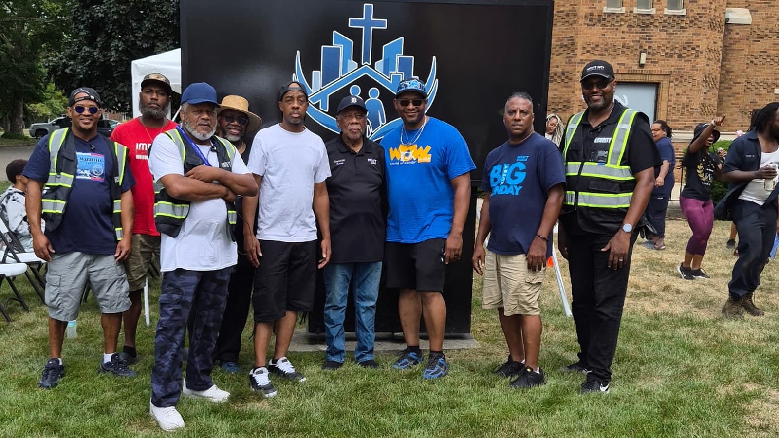 Iron Men serving at a community event outside Impact City Church