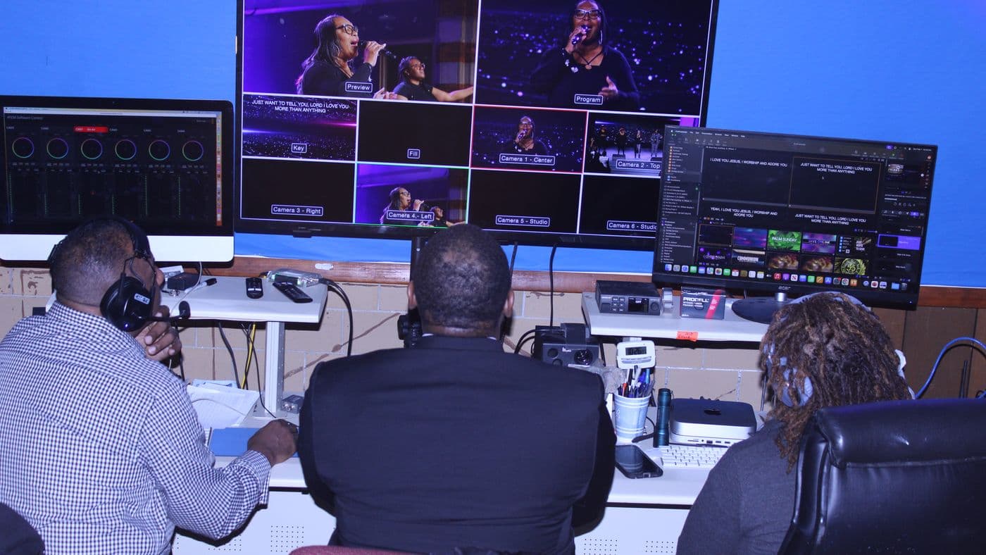 The broadcast team at the control desks on a Sunday