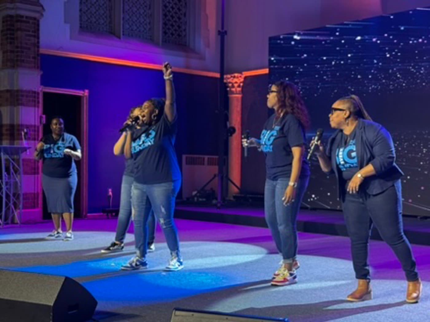 The Impact City worship team leading a Sunday service
